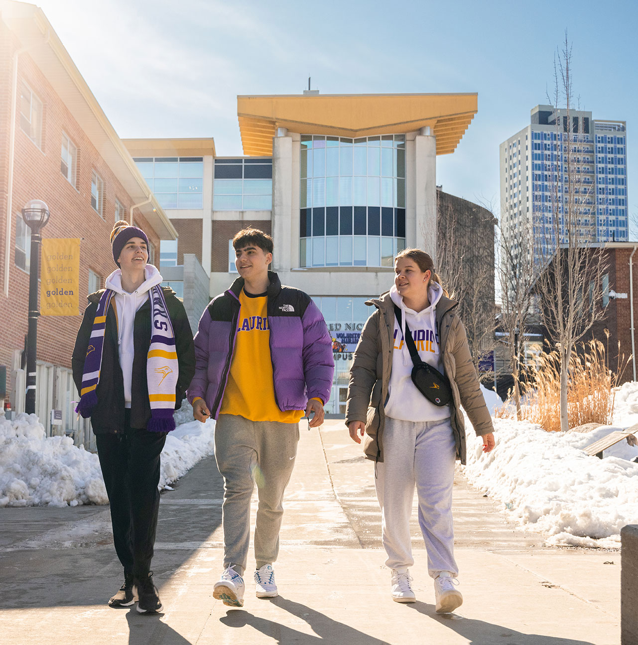 Students walking in front of Fred Nichols Centre during Winter