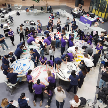 Groups of student participating in a building activity in the centre of an atrium