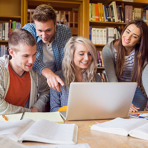 Students researching in library