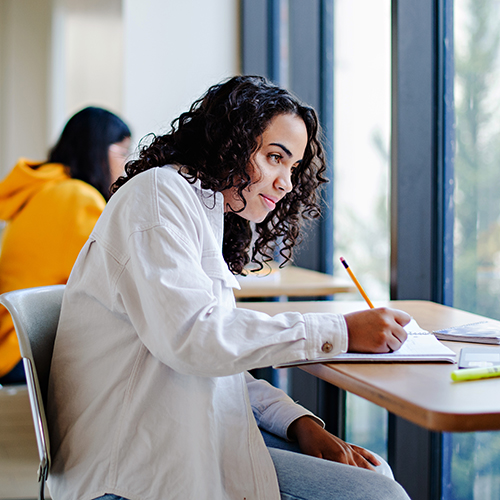 student writes notes