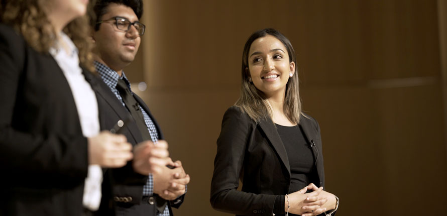 Students presenting on stage