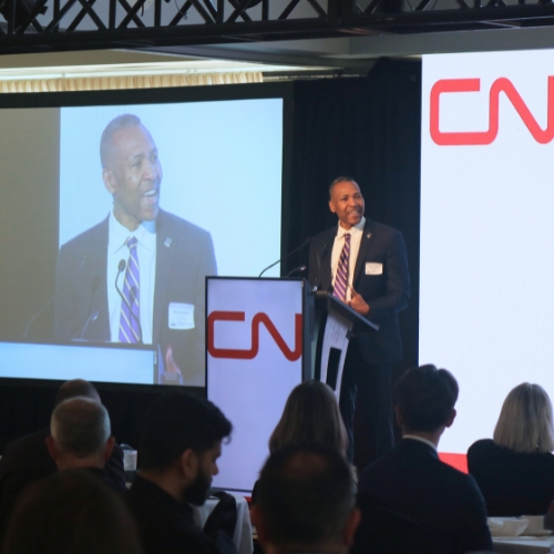 Audience listening to speaker on stage