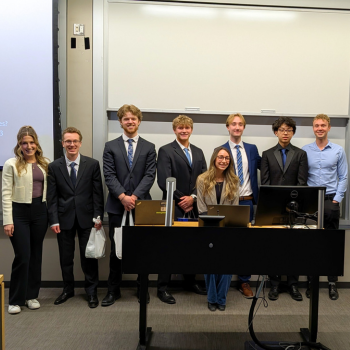 Envoy Consulting with Unilever representatives standing at front of classroom