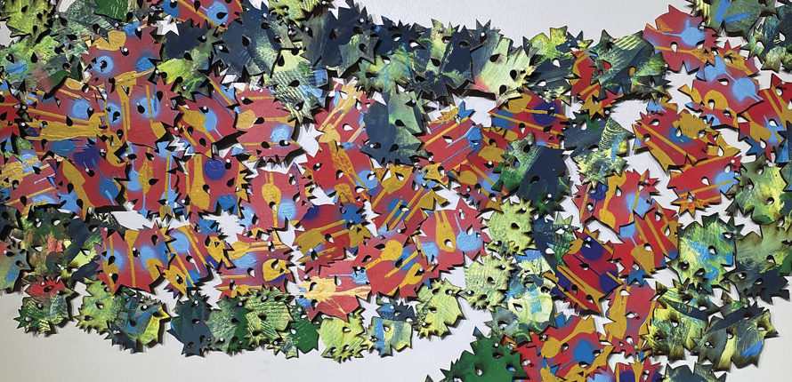 Flat, pointed shapes of similar size and form, scattered across a surface