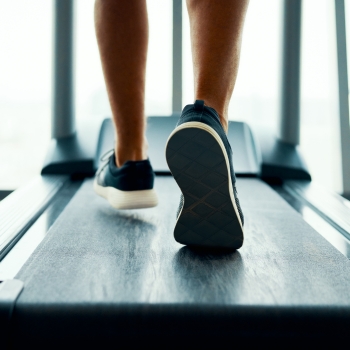 Feet walking on a treadmill