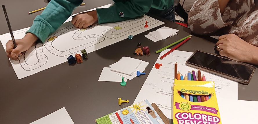 Family designing a board game