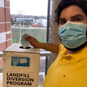 Man holding disposable masks