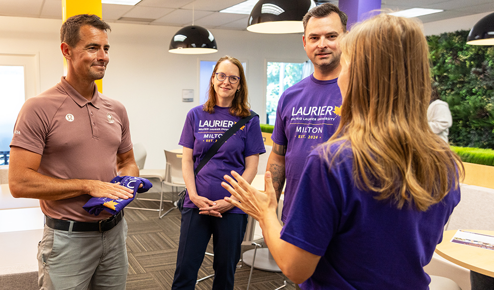 Adam van Koeverden speaks with Laurier representatives