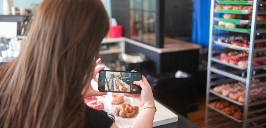 Olivia Kostopoulos capturing content at Lady Glaze