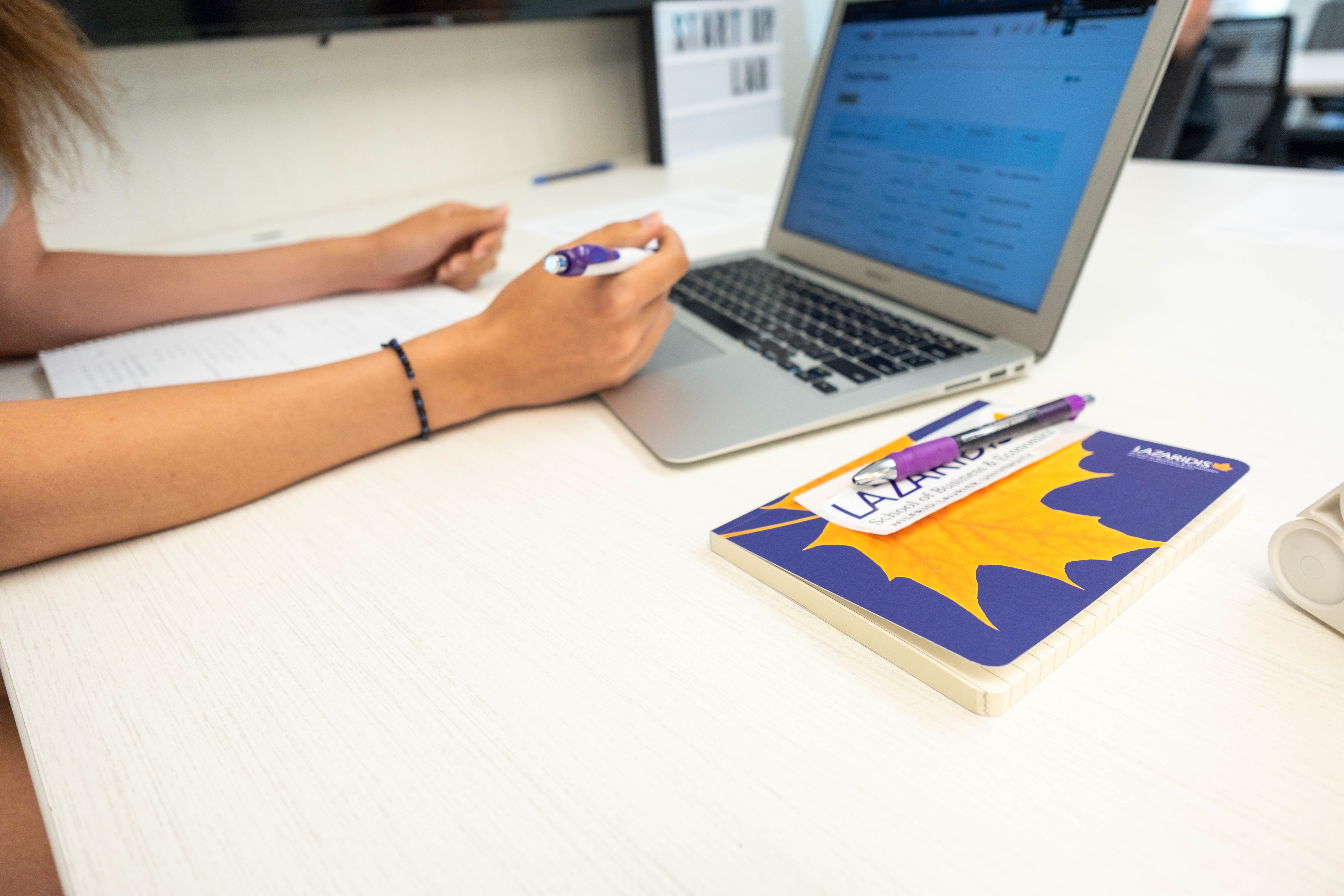 laurier book with laptop