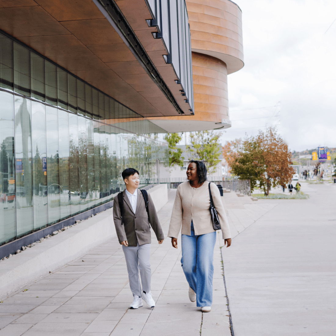 Students walking outside in front of Lazaridis Hall