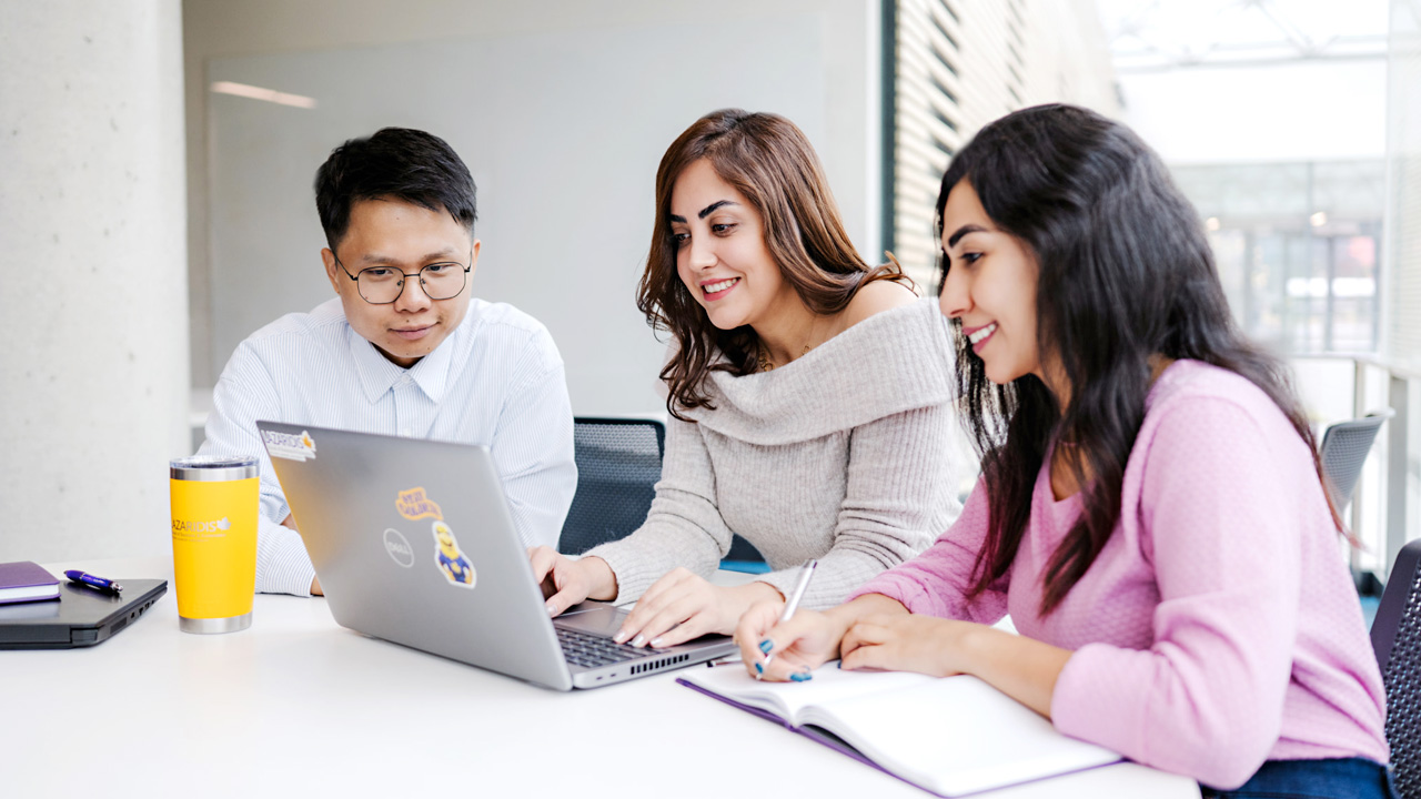 MSc in Management students working together at a table
