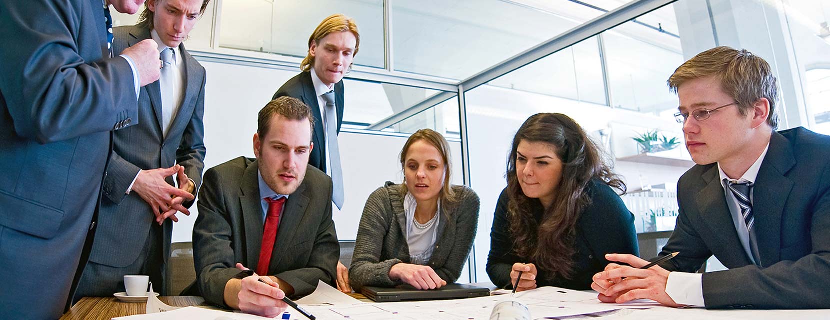 group of students collaborating in office space
